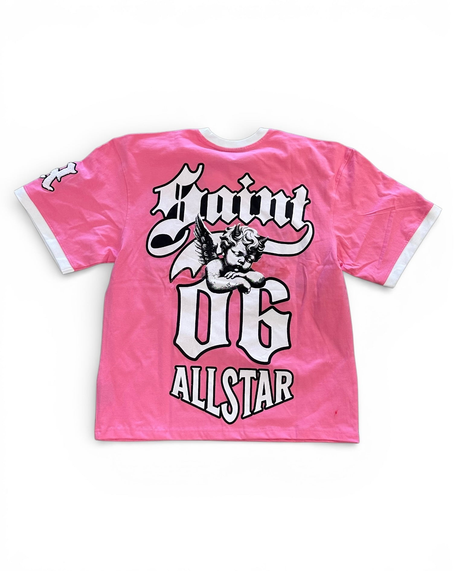 Pink t-shirt with graphic design and text on a white background