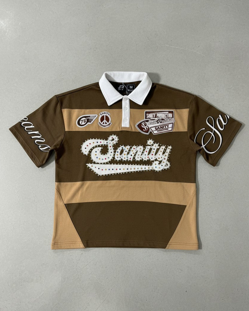 Brown and beige polo shirt with white text and logos on a gray background