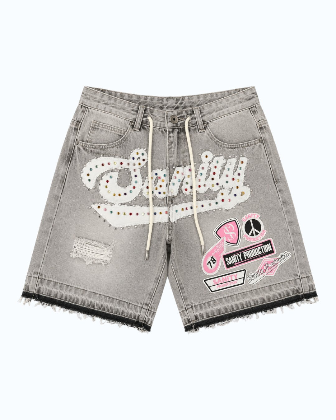 Gray denim shorts with patches and branding on a white background