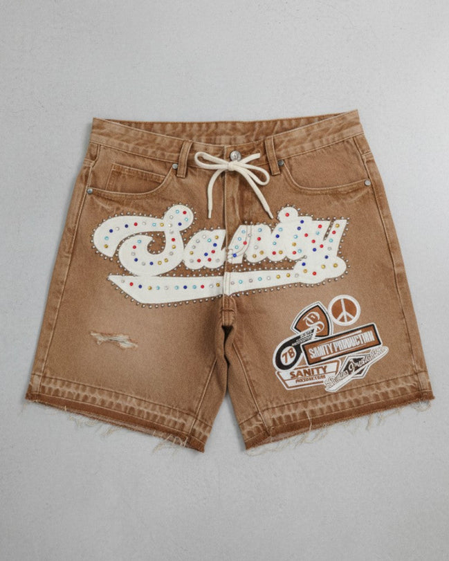 Brown shorts with colorful text and graphics on a gray background