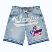 Light blue denim shorts with brand logos on a white background