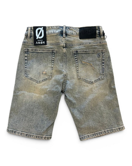 Back view of a distressed denim short with brand label on a white background