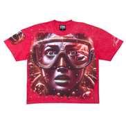 Red t-shirt with a graphic design of a face wearing goggles on a white background