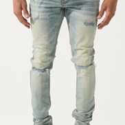 Light blue distressed jeans worn by a person on a white background