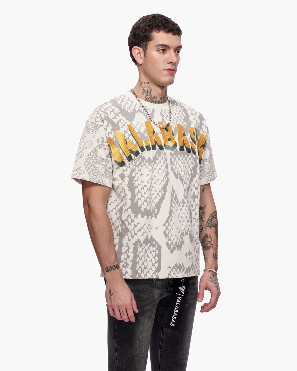 Man wearing a snake print t-shirt with text on a white background