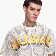 Man wearing a graphic t-shirt with text and design elements on a white background