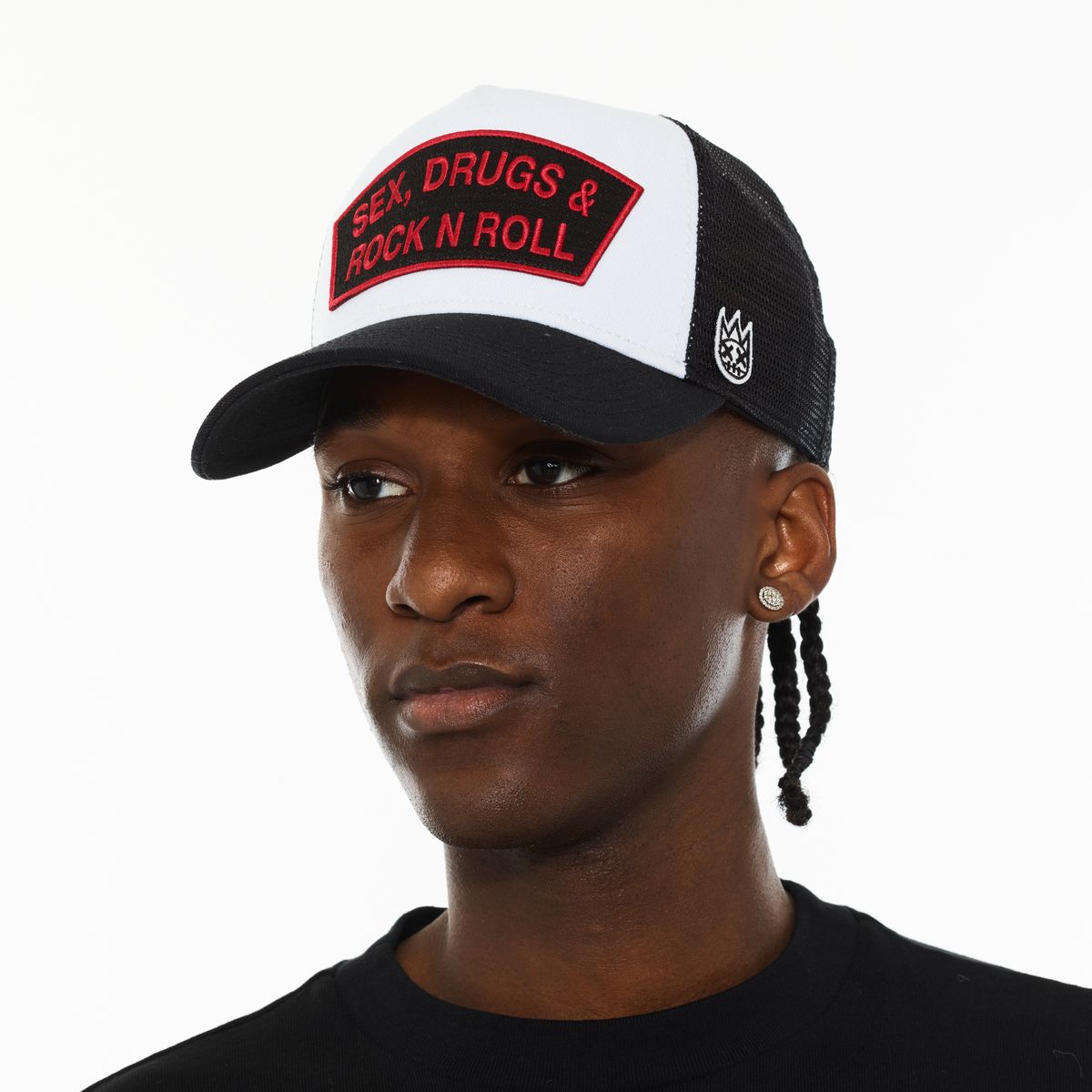 person wearing a black, white, and red hat that reads "Sex Drugs Rock  Roll" on the front face. 
