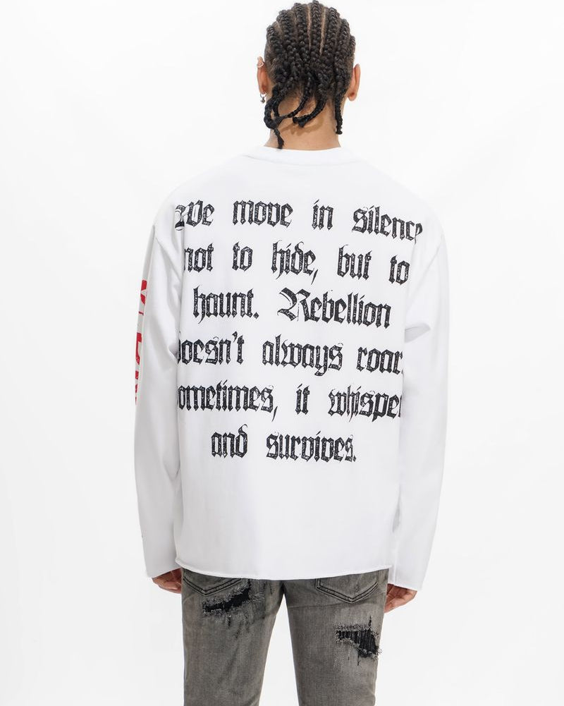 Person wearing a white sweatshirt with text on the back, standing against a white background