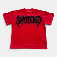 Red t-shirt with 'SHATTERED' graphic on a white background