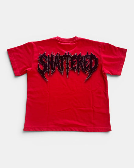 Red t-shirt with 'SHATTERED' graphic on a white background