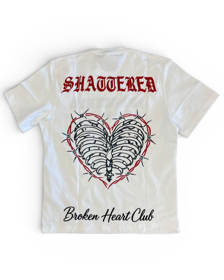 T-shirt with 'Shattered' and 'Broken Heart Club' design on a white background