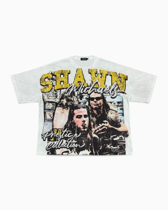A white graphic t-shirt featuring a distressed print of Shawn Mendes with yellow and black text reading 'SHAWN' and 'Pretend Collection'.
