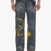 Blue jeans with a dragon design on a white background