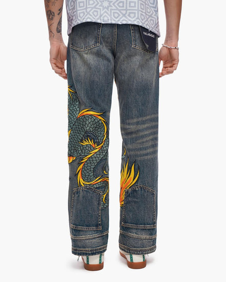 Blue jeans with a dragon design on a white background