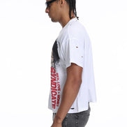 Person wearing a white t-shirt with red text on a white background