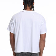 Person wearing a white t-shirt and gray pants on a white background