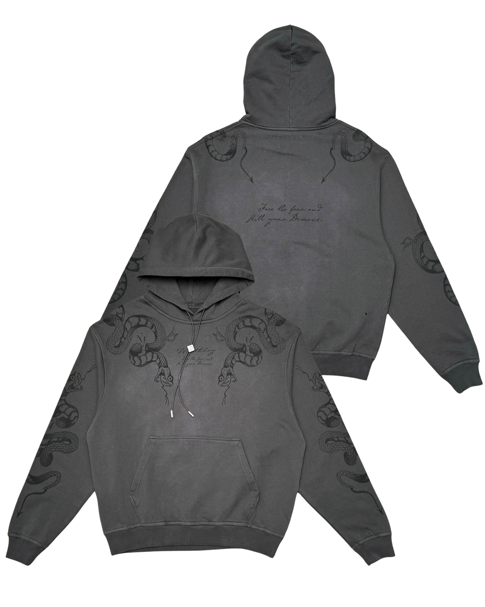 Dark gray hoodie with embroidered designs on a white background