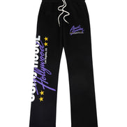 Black sweatpants with white drawstrings, featuring purple and white graphic text on the left leg and a purple logo on the right thigh, displayed against a solid white background.