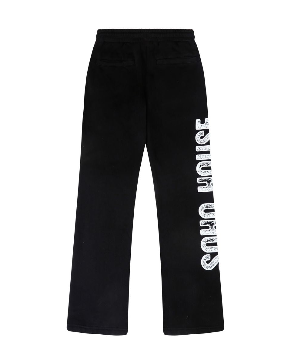 Black wide-leg sweatpants with a vertical white 'SOHO HOUSE' logo printed down the left leg, shown against a plain white background.