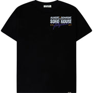A dark navy blue short-sleeve athletic t-shirt with green trim along the collar, featuring the white 'ALMOST SOMEDAY' brand logo on the right chest and a red and white rugby crest on the left chest.
