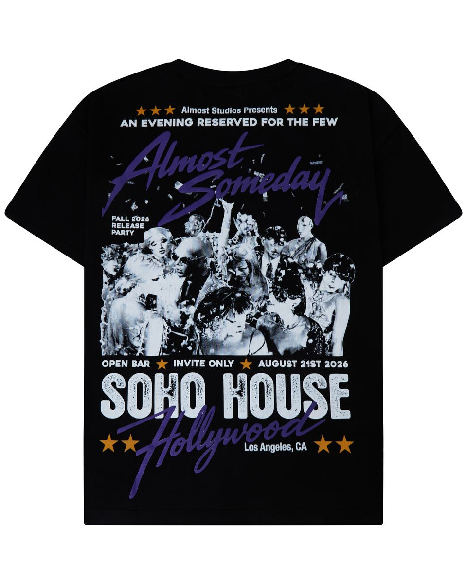 A black short-sleeve graphic t-shirt featuring a vintage-style concert poster design for 'SOHO HOUSE Hollywood' with a black-and-white band photo and purple and white text.