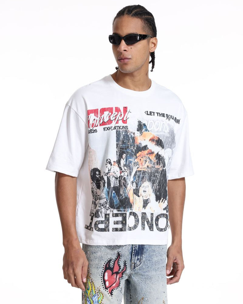 Person wearing a white graphic t-shirt with colorful designs and text.