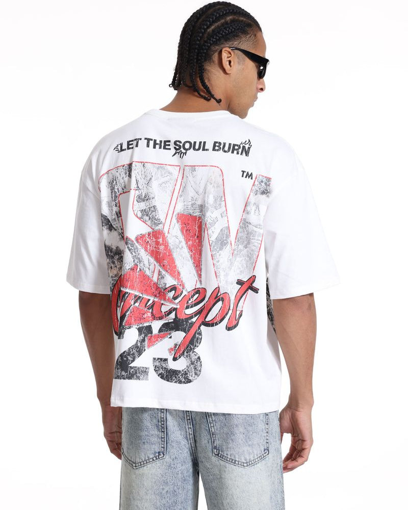 Person wearing a white t-shirt with graphic design and text, standing against a white background
