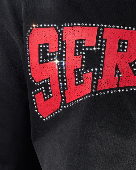 Black sweatshirt with red 'SER' text and rhinestone embellishments.