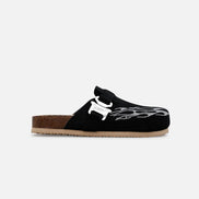 Black sandal with white design on a white background