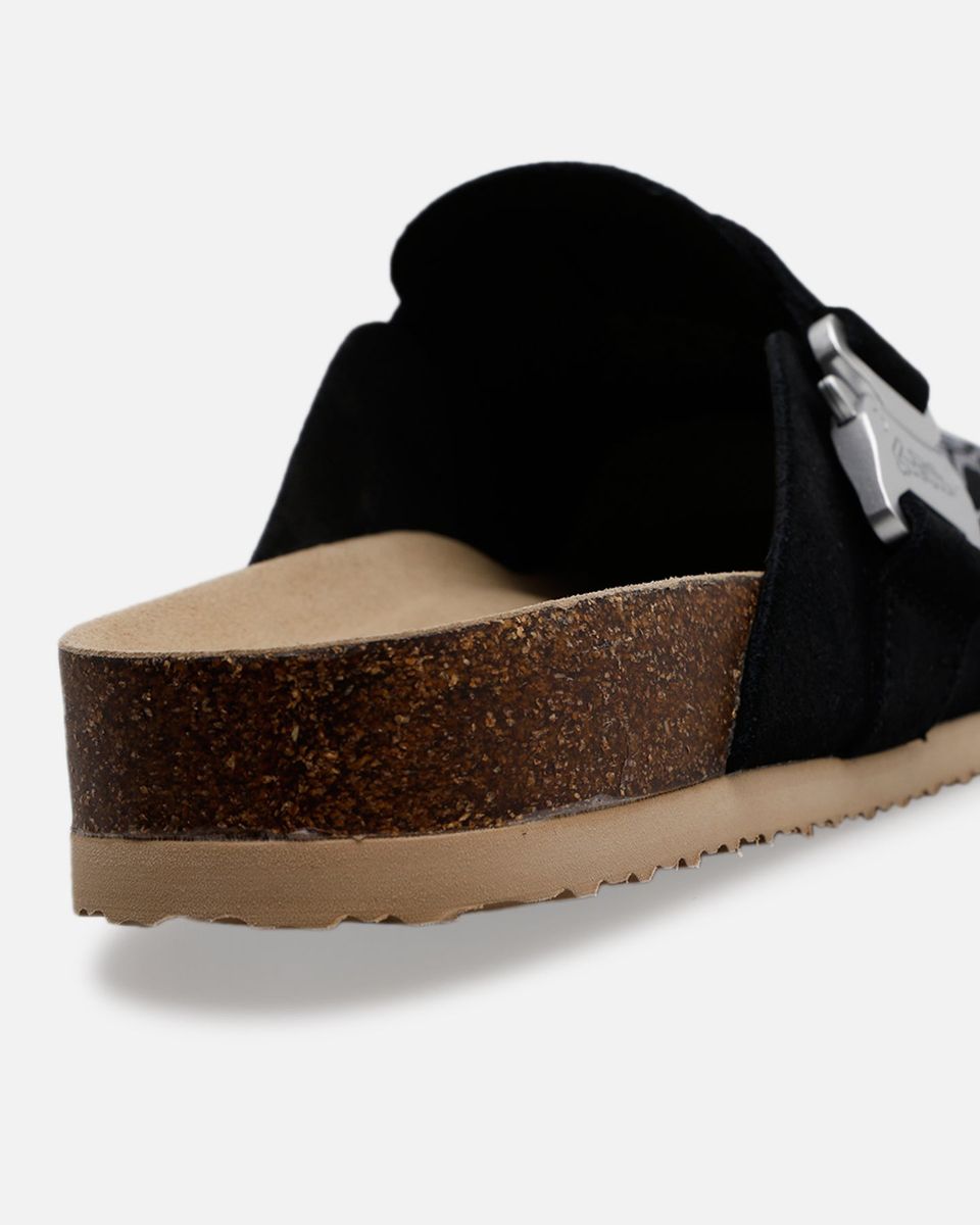 Black sandal with cork wedge sole on a white background