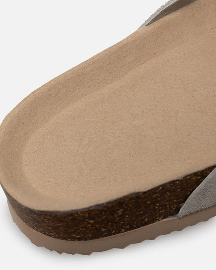 Close-up of a sandal sole with cork insole on a white background