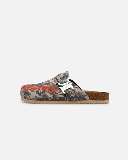 Camouflage sandal with a white buckle on a white background