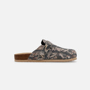 Clog shoe with camouflage pattern on a white background