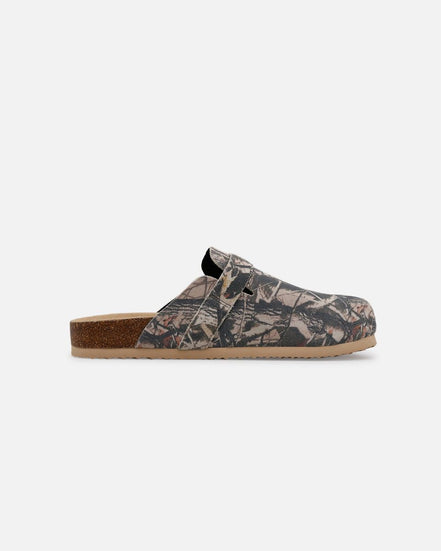 Clog shoe with camouflage pattern on a white background