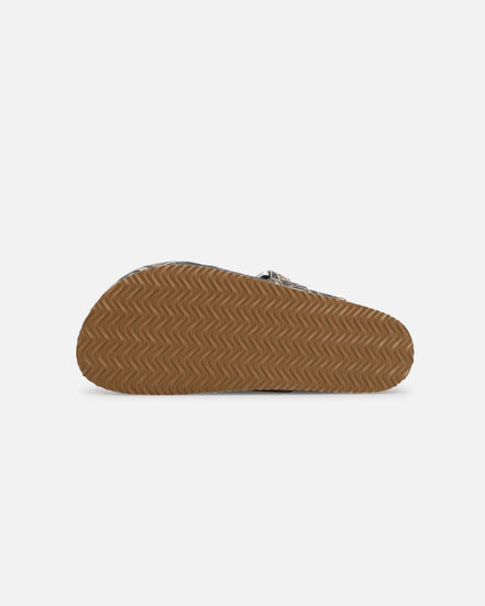 Brown sandal sole on a light gray background