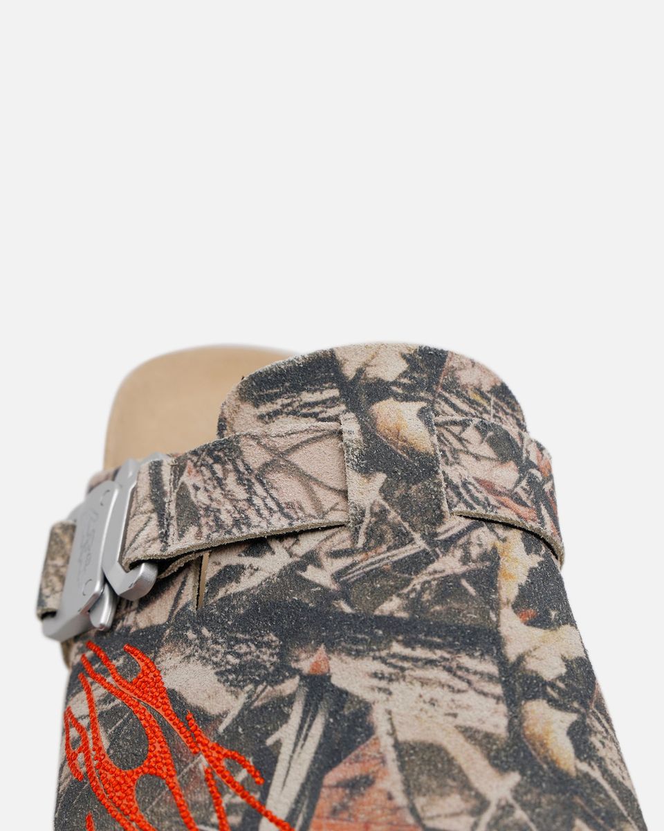 Camouflage-patterned belt with red accents on a mannequin against a white background
