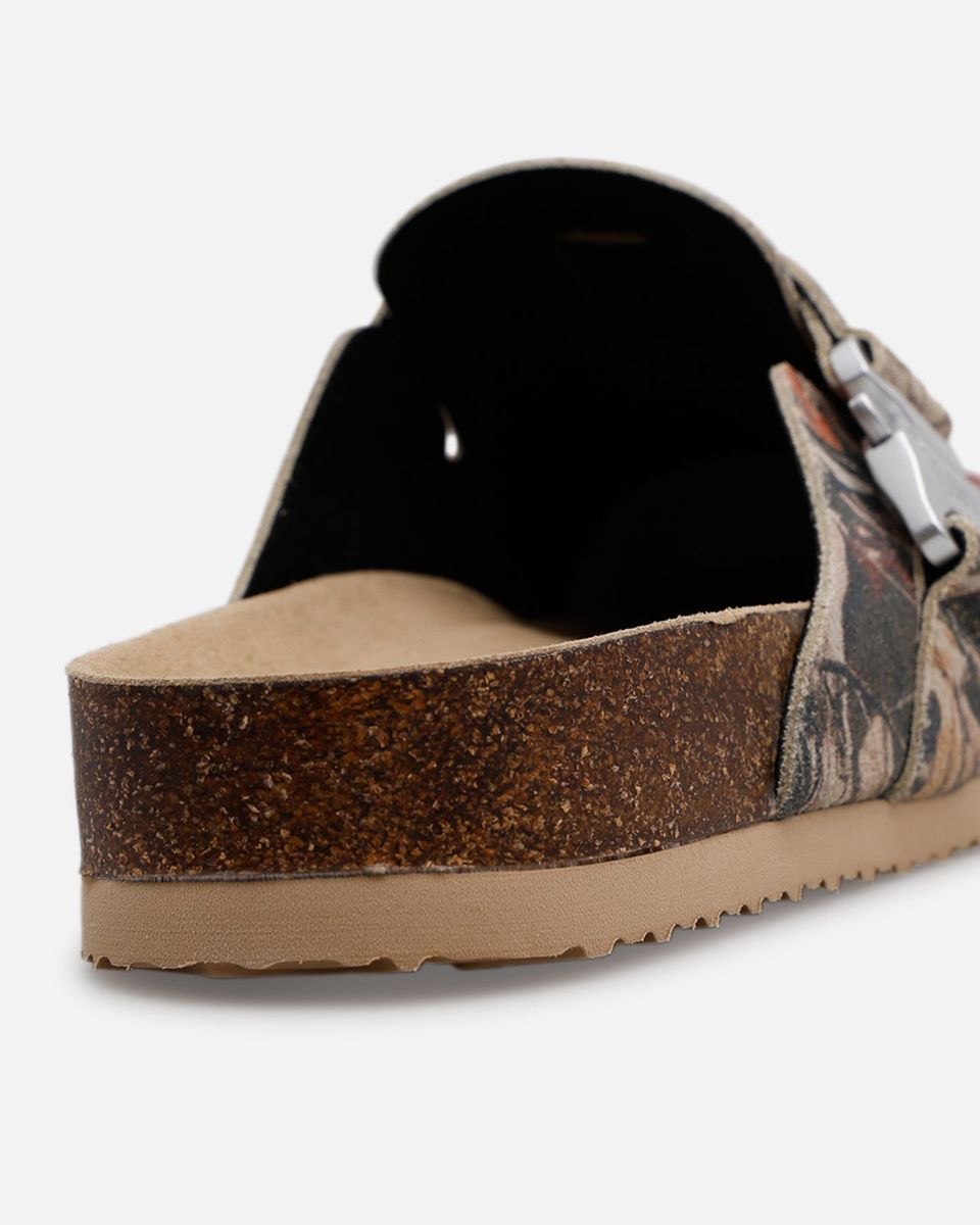 Brown sandal with cork sole on a white background