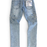 Light blue jeans with rhinestone embellishments on a white background