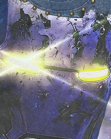 Close-up of a futuristic helmet with glowing yellow visor and intricate design.
