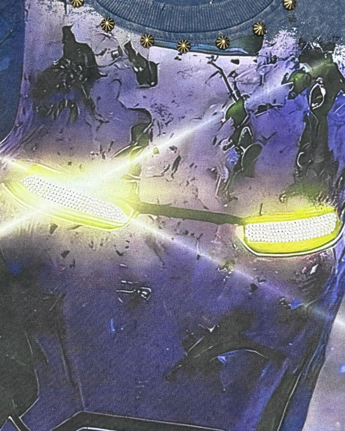 Close-up of a futuristic helmet with glowing yellow visor and intricate design.