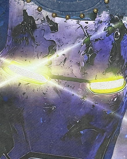 Close-up of a futuristic helmet with glowing yellow visor and intricate design.