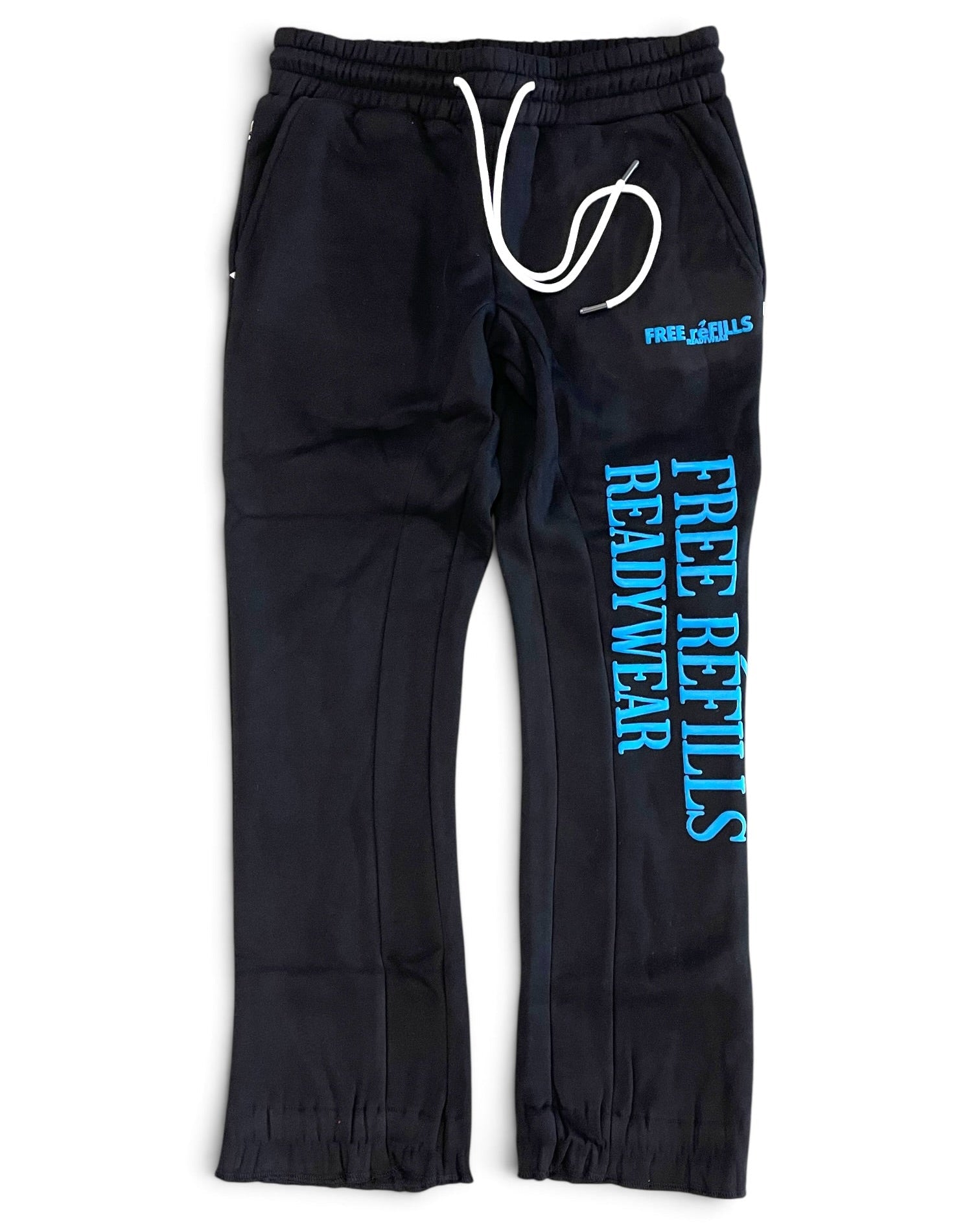 Black sweatpants with a white drawstring and bright blue 'FREE REFILLS READYWEAR' text printed on the left leg, shown against a plain white background.