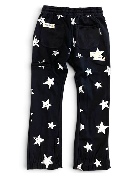 Black pants with an all-over white star pattern, featuring an elastic waistband, side cargo pockets, and elastic cuffs at the ankles, shown flat on a white background.