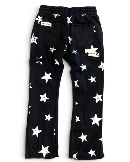 Black pants with an all-over white star pattern, featuring an elastic waistband, side cargo pockets, and elastic cuffs at the ankles, shown flat on a white background.