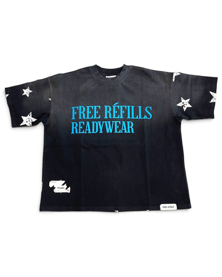 A black short-sleeve t-shirt with 'FREE REFILLS READYWEAR' printed in bright blue across the chest, decorated with white star graphics on the sleeves and hem, and a small white brand tag near the bottom right.