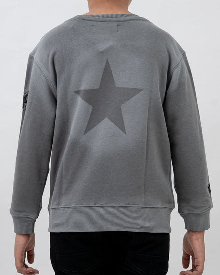 Gray sweatshirt with a star design on the back worn by a person against a white background