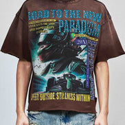 Person wearing a graphic t-shirt with a car design and text on a plain background