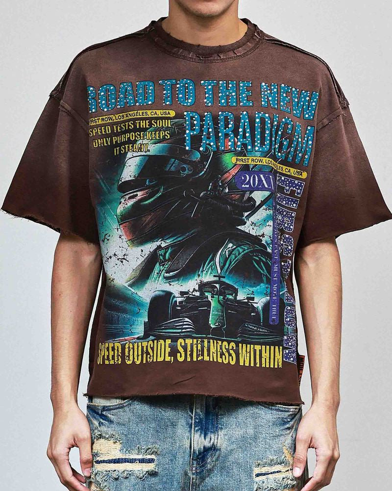 Person wearing a graphic t-shirt with a car design and text on a plain background