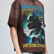 Person wearing a graphic t-shirt with a motorcycle design and text on a plain background