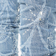 Close-up of a denim jeans with rhinestone embellishments